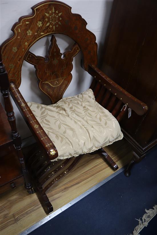 An Indian brass inlaid hardwood folding X-frame chair